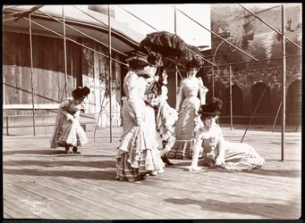 Five actresses in costume rehearsing on the roof of what is probably the New York Theatre, New York
